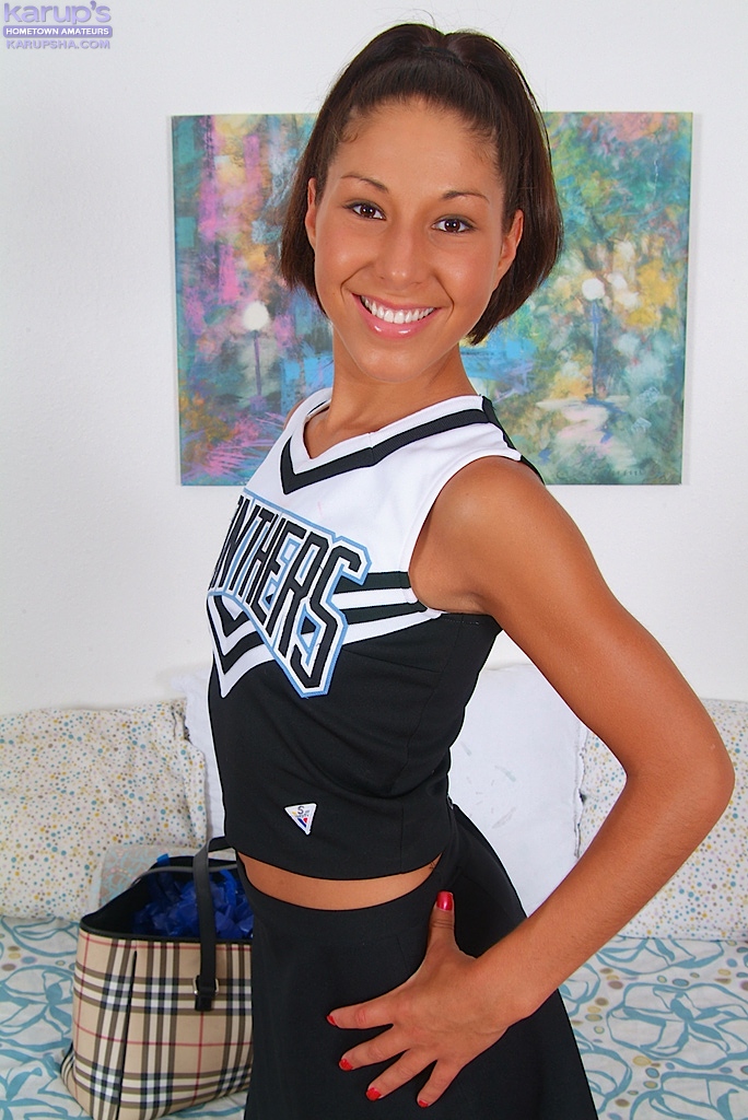 perky-cheerleader-isabella-strips-down-to-her-white-socks-2
